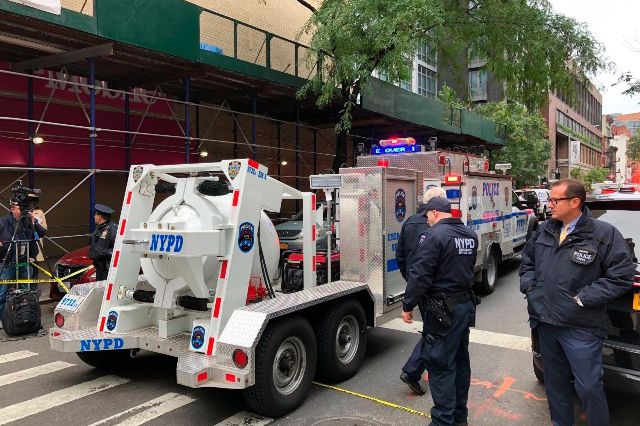 The NYPD's Total Containment vessel arrives as law enforcement respond to the scene of a suspicious package at a postal facility on West 52nd Street. The suspicious package was discovered by postal workers.